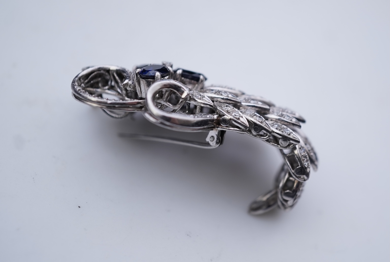 A sapphire and diamond brooch, mid 20th century